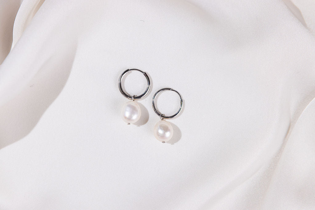 Pearl earrings on a white background