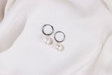 Pearl earrings on a white background