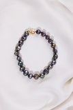 Black Pearl bracelet with a gold clasp on a white background