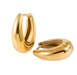 Gold hoop earrings on a white background