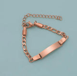 Rose gold chain bracelet on a light blue background