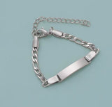 Silver chain bracelet on a light blue background