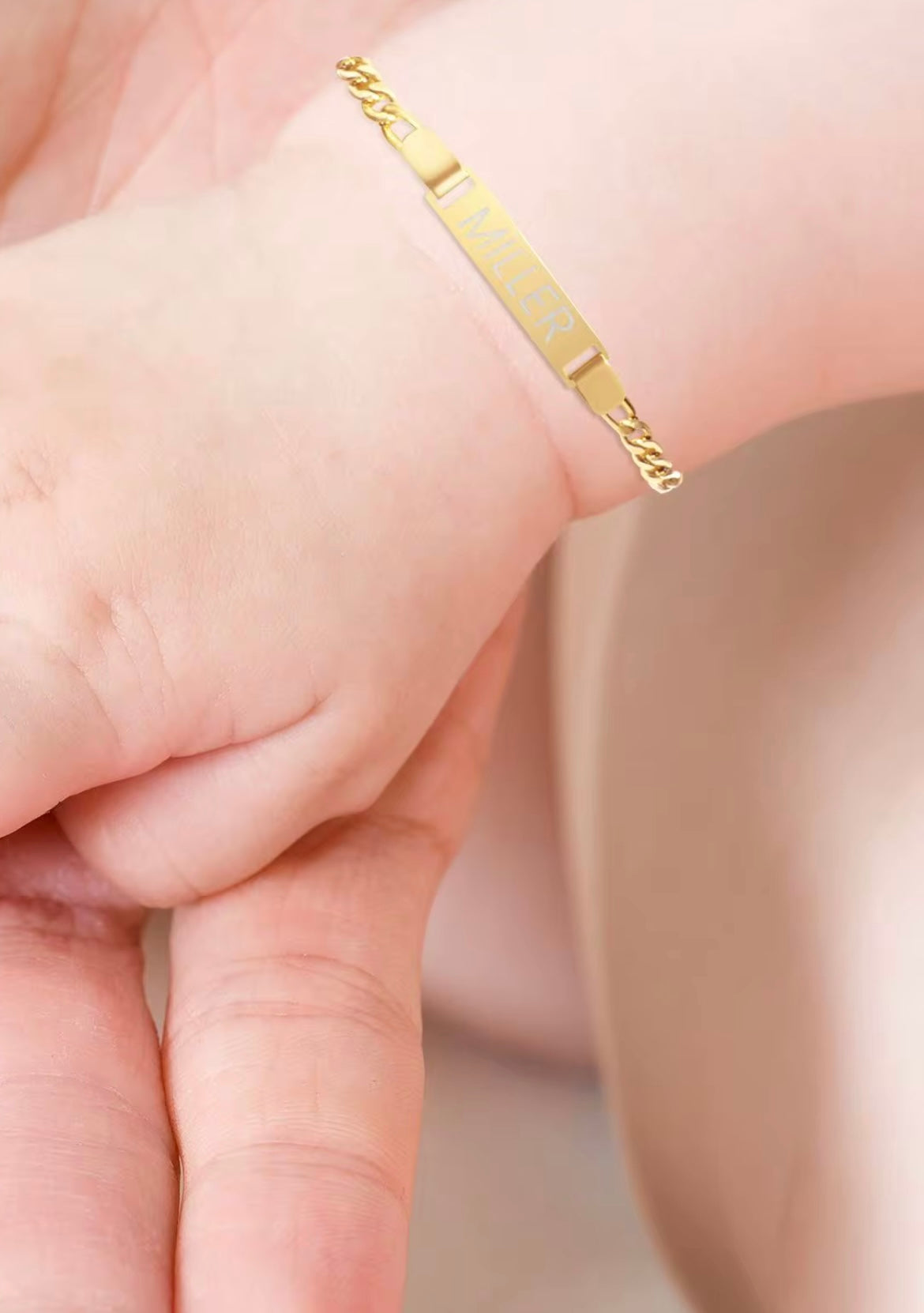 Engraved Gold bracelet on a baby