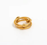 Gold ring with multiple intertwined bands on a white background