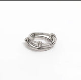 Set of silver rings stacked on a white background