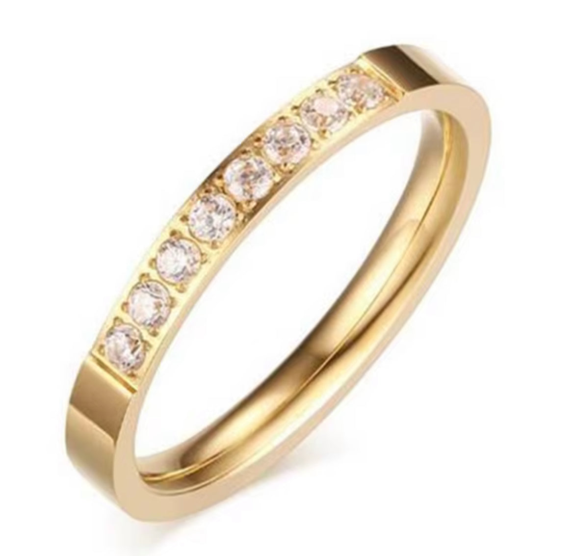 Gold ring with embedded diamonds on a white background