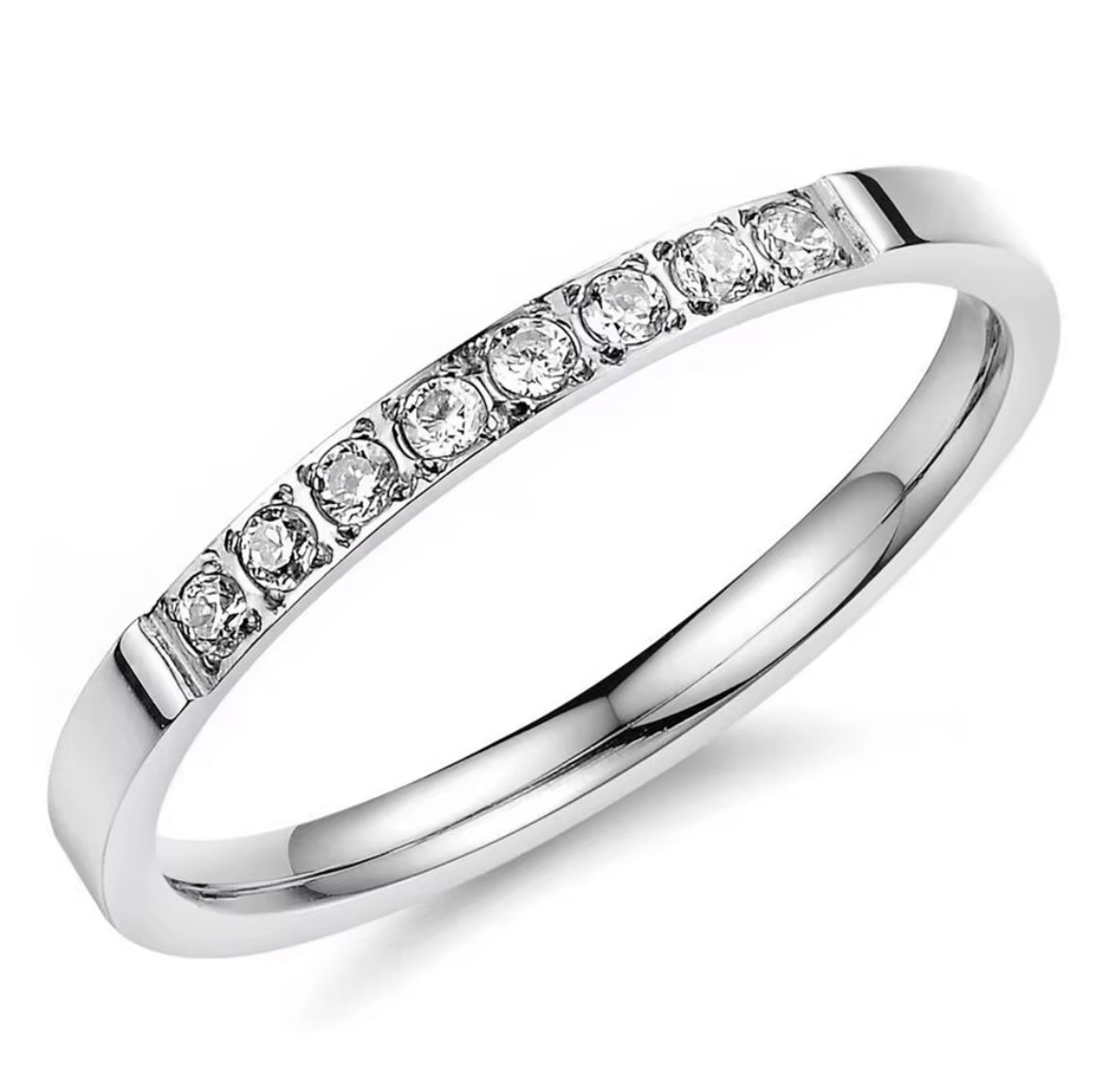 Silver ring with small diamonds on a white background