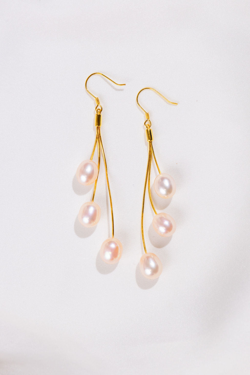 3 Pink pearl long drop earrings