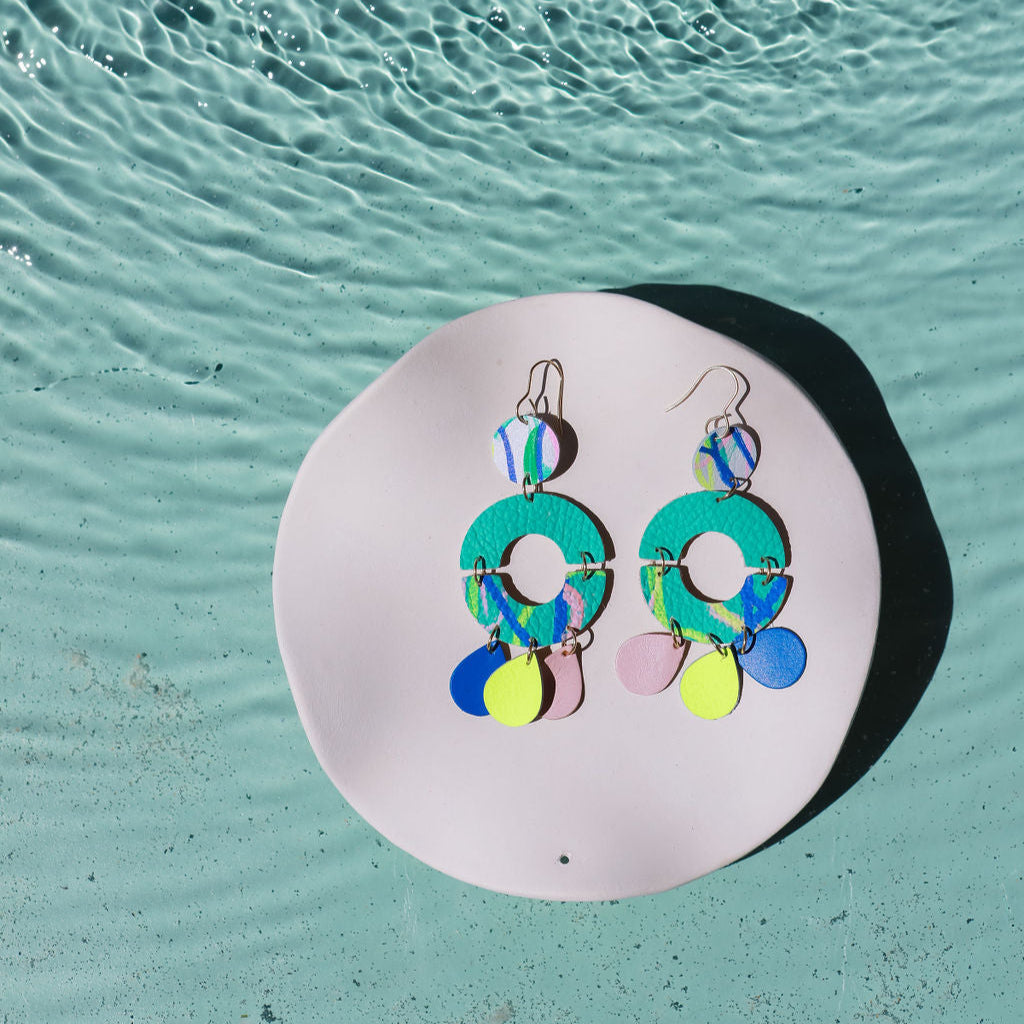 Aqua unity dangle statement earrings