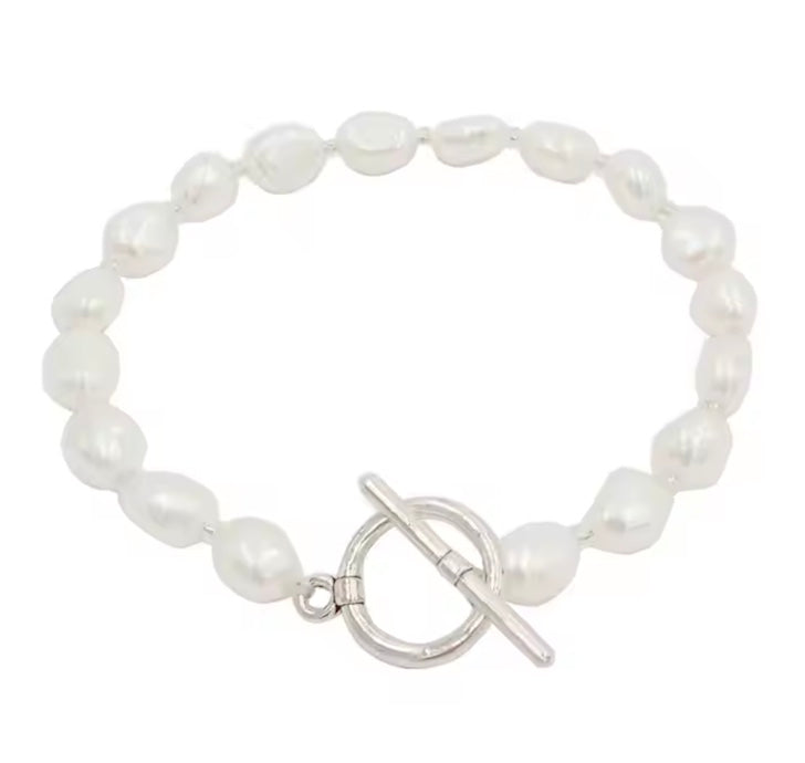 White Pearl bracelet with a silver clasp on a white background
