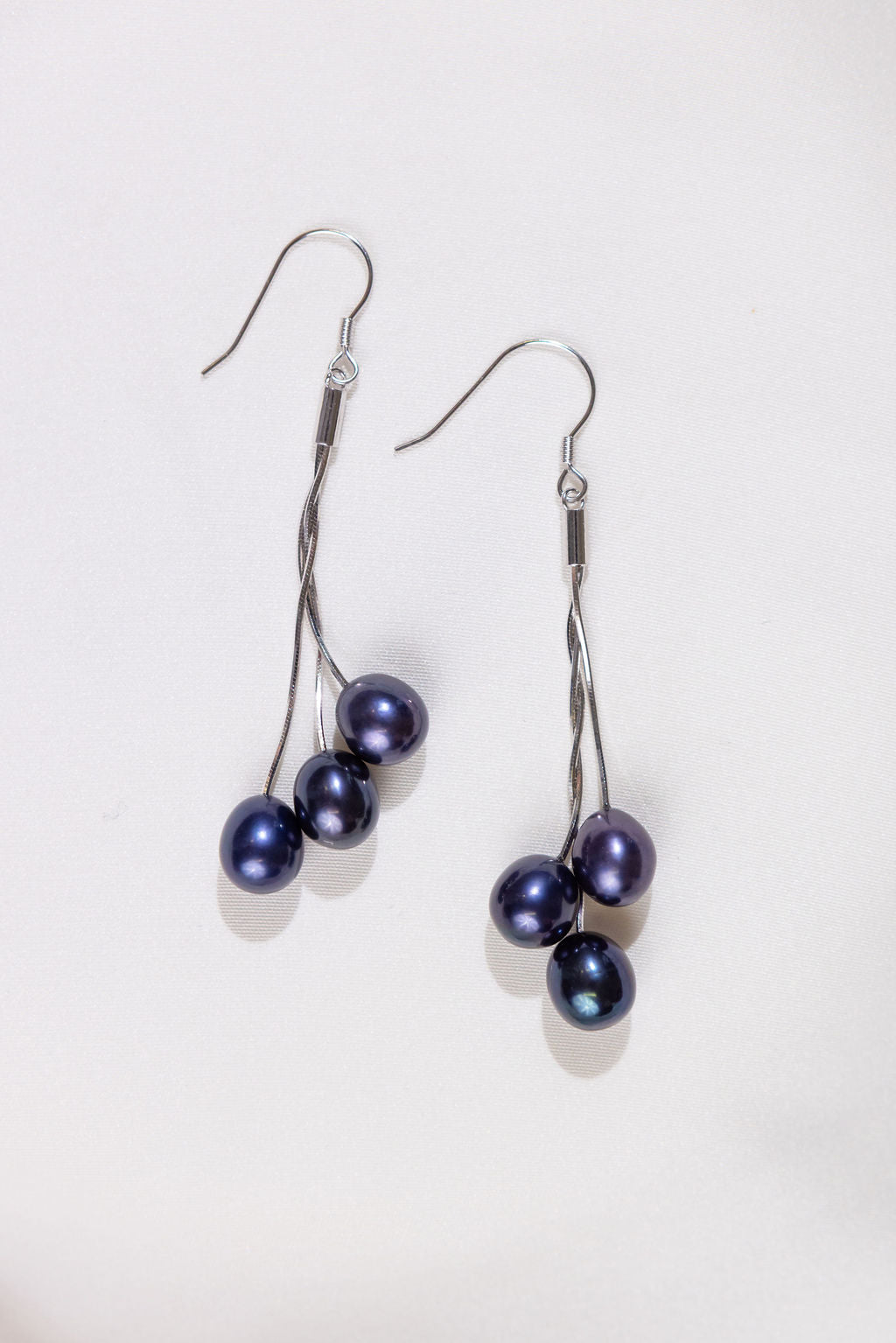 Pair of black pearl long drop silver earrings 
