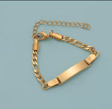 Gold chain bracelet on a light blue background