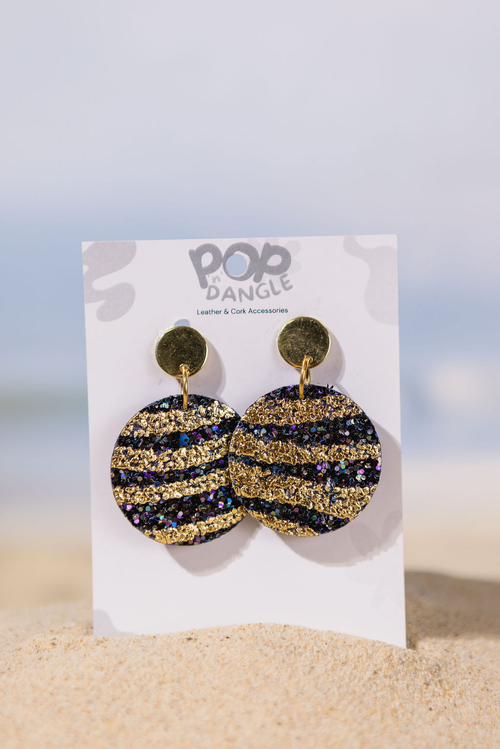 Gold sparkling tiger stripe round leather earrings 