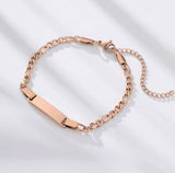 Rose gold chain bracelet on a light background