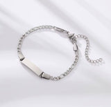 Silver chain bracelet on a light gray background