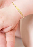 Engraved Gold bracelet on a baby