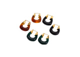 Set of five hoop earrings with gold accents on a white background