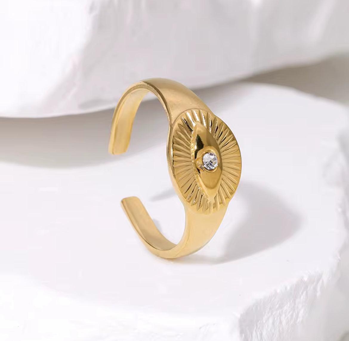 open gold ring with a sunray 