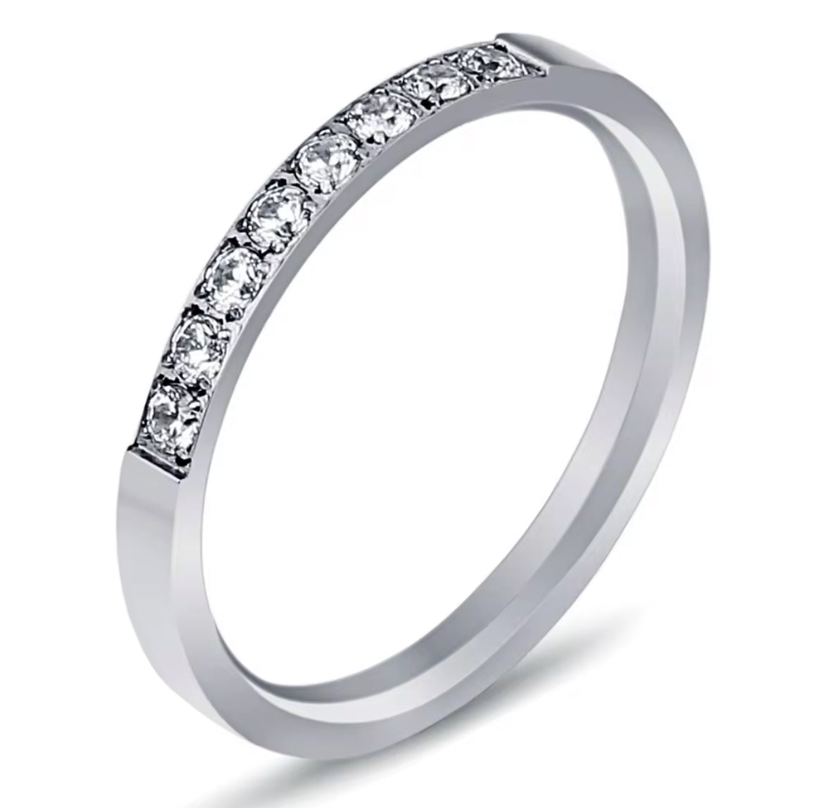 Silver ring with small diamonds on a white background