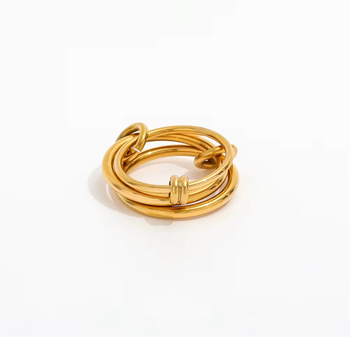 Gold ring with multiple intertwined bands on a white background