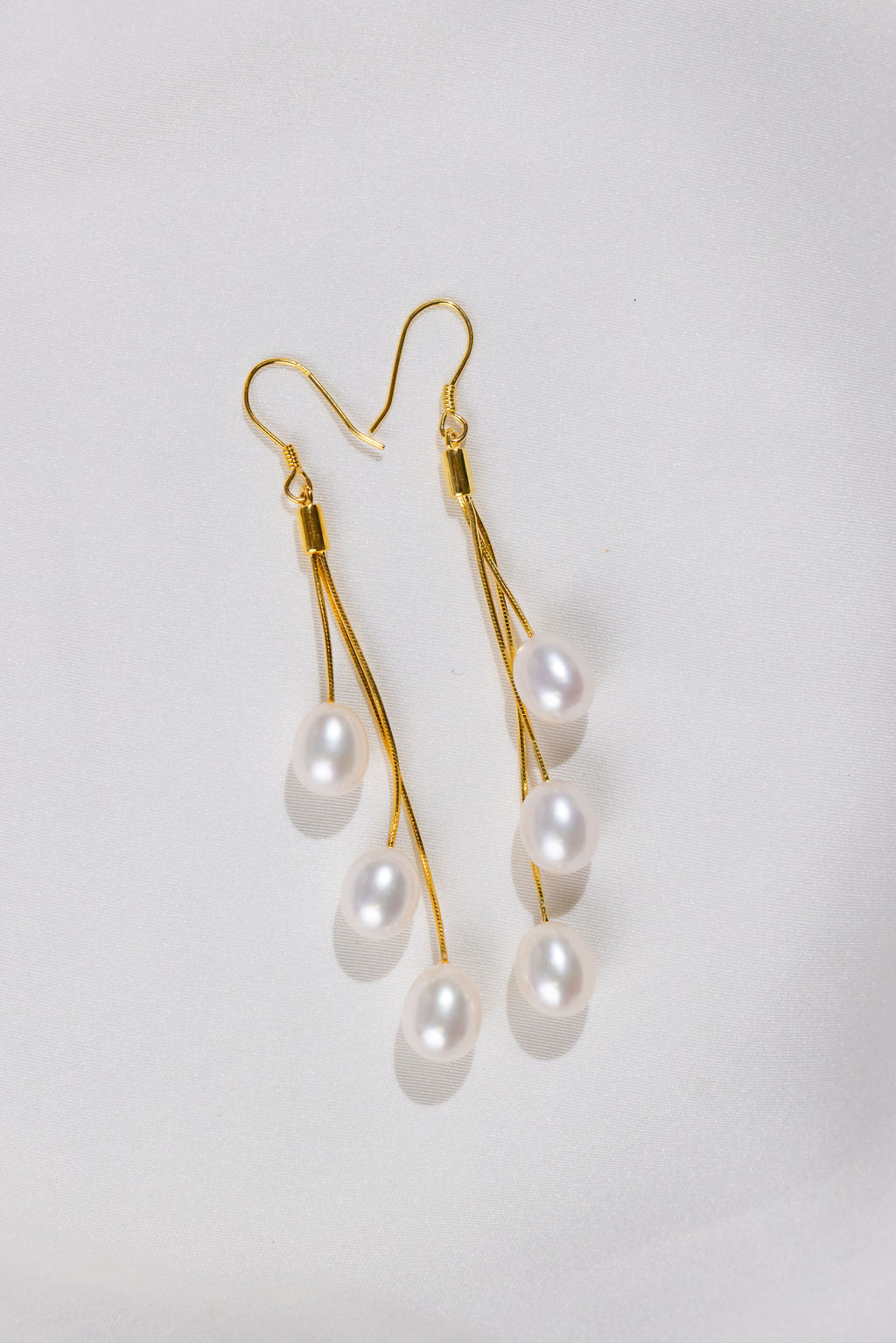 3 White Pearl long drop earrings with gold hooks 